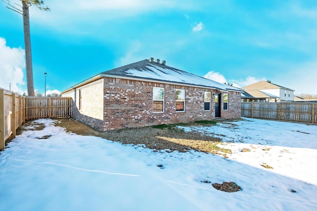 view of snow covered property