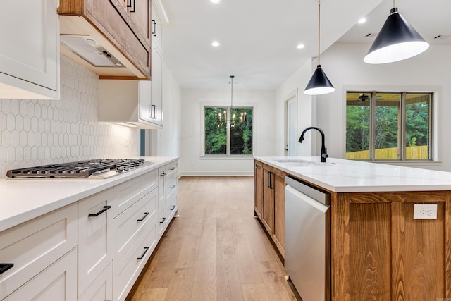 kitchen featuring a large island, white cabinets, and stainless steel appliances