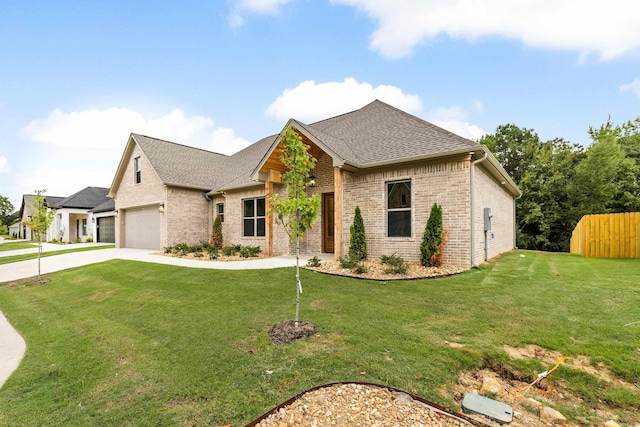 view of front facade featuring a front yard and a garage