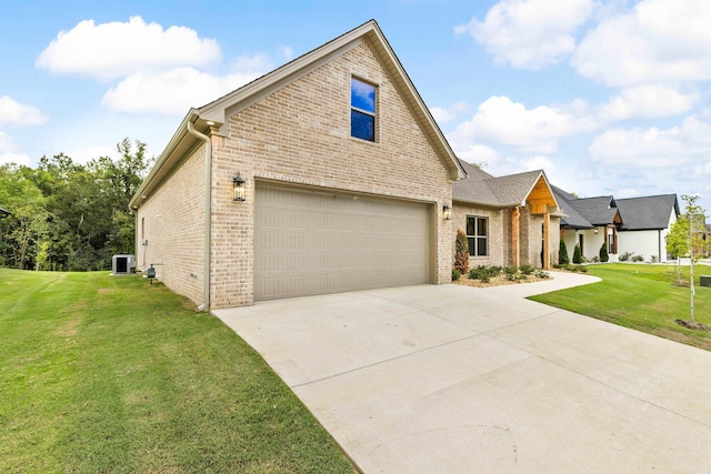 view of front of home featuring central AC unit, a garage, and a front lawn