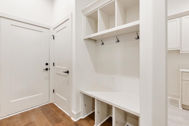 mudroom with light hardwood / wood-style flooring