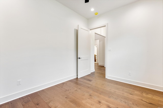 unfurnished room with hardwood / wood-style floors