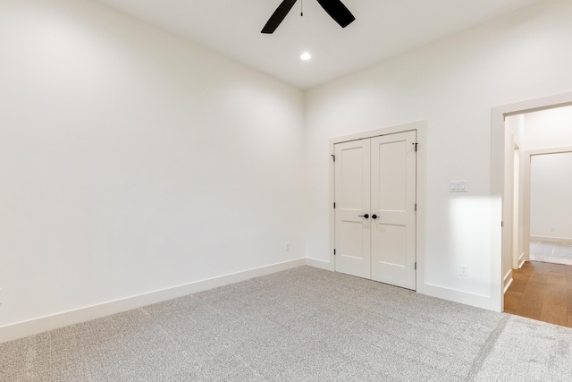 empty room with carpet and ceiling fan