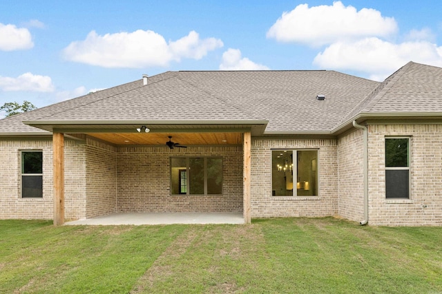 rear view of house with a lawn, ceiling fan, and a patio