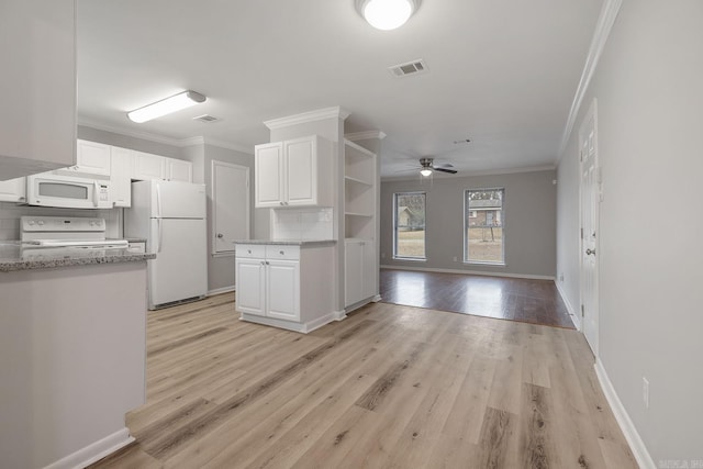 kitchen featuring backsplash, white appliances, white cabinetry, and light wood-type flooring