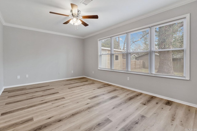 spare room with ceiling fan, crown molding, and light hardwood / wood-style flooring