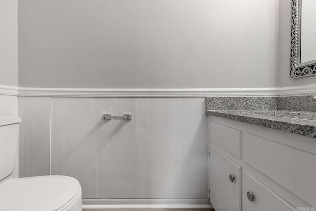 bathroom with vanity and toilet