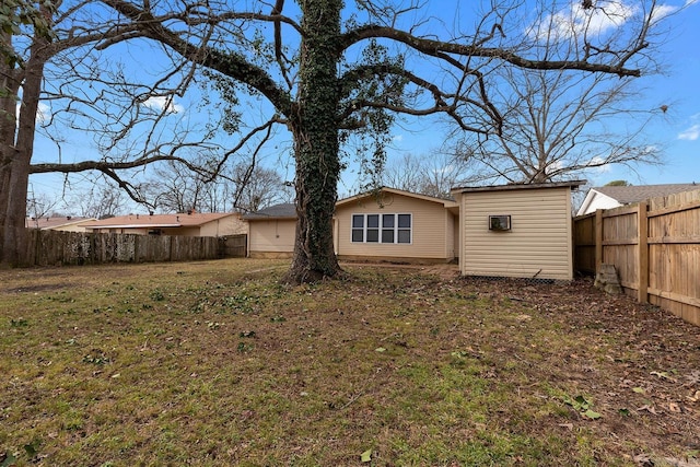 back of property featuring a yard