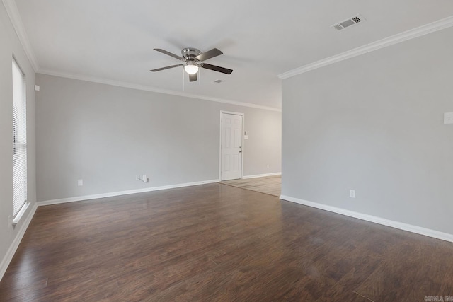 empty room with ceiling fan, dark hardwood / wood-style floors, and ornamental molding