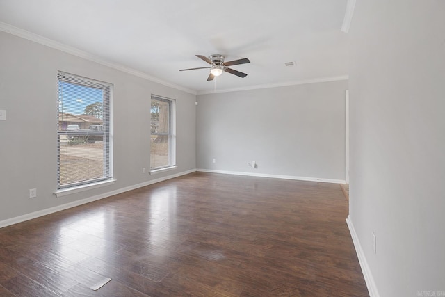 spare room featuring dark hardwood / wood-style floors, ceiling fan, and ornamental molding