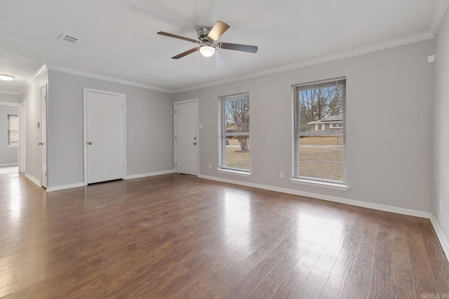 unfurnished room with ceiling fan, crown molding, and dark wood-type flooring