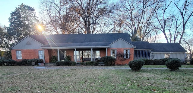 ranch-style home with a front lawn