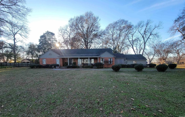 view of front of property with a yard