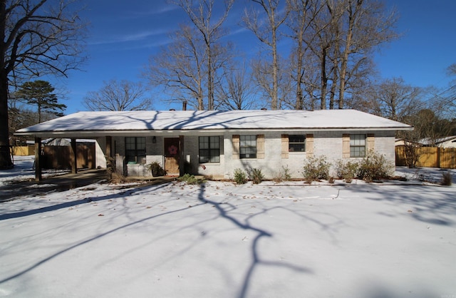 view of snow covered house