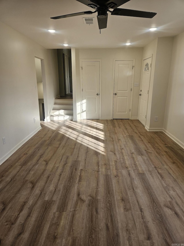 interior space featuring dark hardwood / wood-style floors and ceiling fan