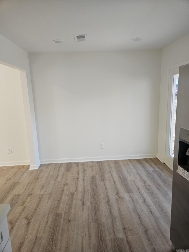 unfurnished living room with light hardwood / wood-style flooring