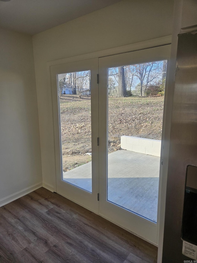 doorway to outside featuring dark hardwood / wood-style flooring