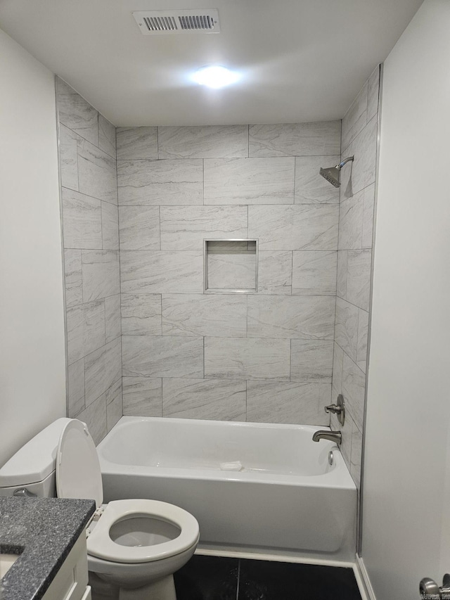 full bathroom with vanity, toilet, and tiled shower / bath combo