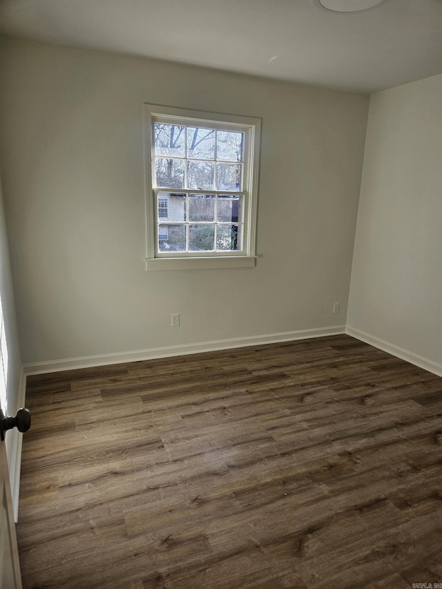 empty room featuring dark hardwood / wood-style floors