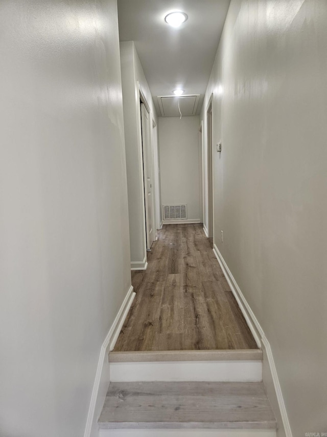 hall with hardwood / wood-style floors