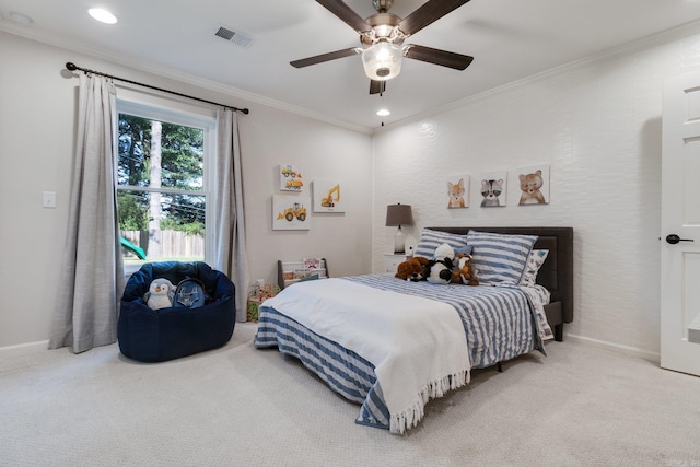 carpeted bedroom with ceiling fan and crown molding