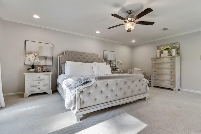 carpeted bedroom featuring ceiling fan and crown molding