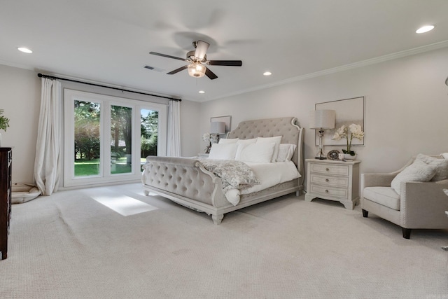 carpeted bedroom featuring ceiling fan and ornamental molding