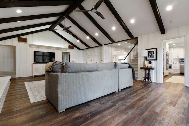 living room with high vaulted ceiling, wooden walls, ceiling fan, beam ceiling, and dark hardwood / wood-style flooring