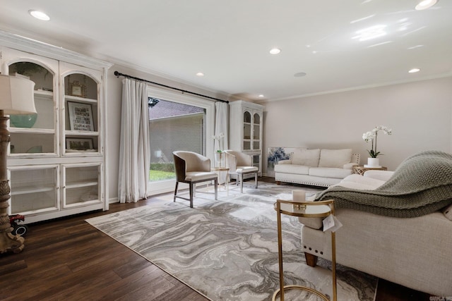 living room featuring dark hardwood / wood-style floors and ornamental molding