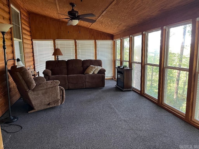 sunroom featuring ceiling fan, wood ceiling, and vaulted ceiling