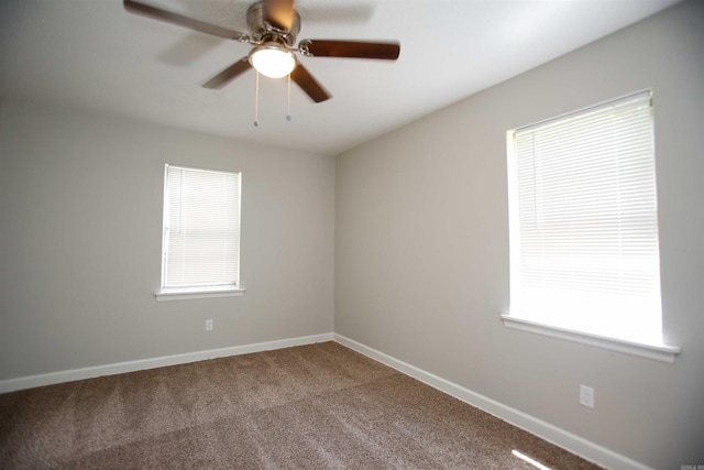 unfurnished room with carpet, ceiling fan, and a healthy amount of sunlight