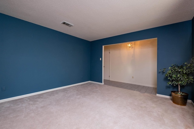 unfurnished bedroom featuring carpet flooring and a textured ceiling