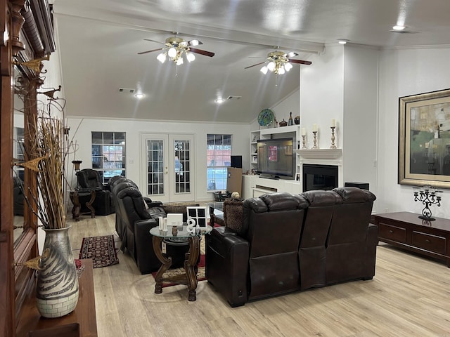 living room with lofted ceiling with beams, light hardwood / wood-style floors, french doors, and ceiling fan