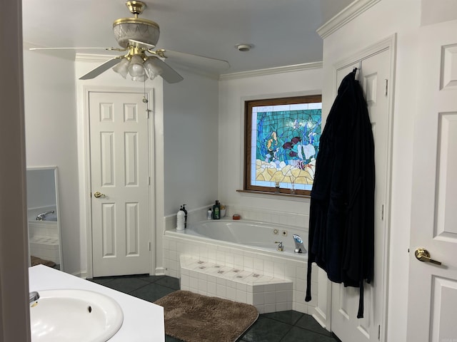 bathroom featuring tile patterned flooring, vanity, ornamental molding, a relaxing tiled tub, and ceiling fan