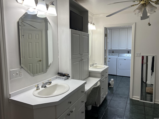 bathroom featuring ceiling fan, washing machine and clothes dryer, vanity, and tile patterned floors