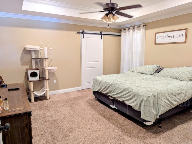 bedroom featuring carpet flooring, a barn door, ceiling fan, and ornamental molding