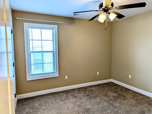 carpeted empty room featuring ceiling fan