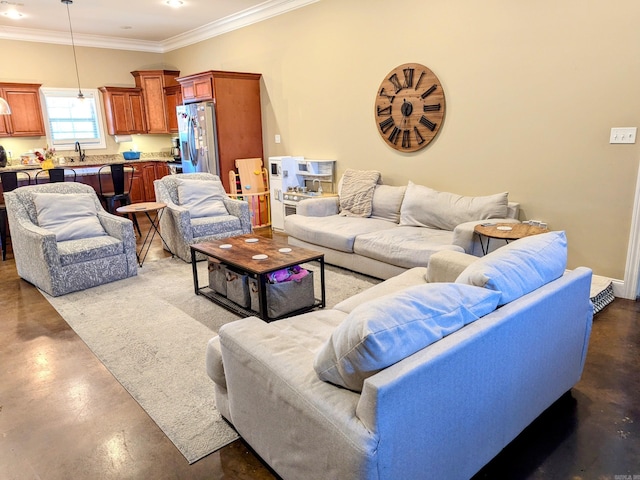 living room featuring concrete floors, crown molding, and sink