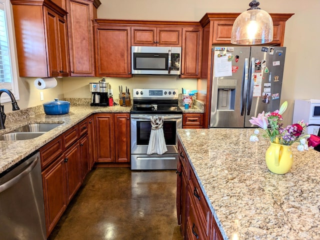 kitchen with pendant lighting, stainless steel appliances, light stone counters, and sink