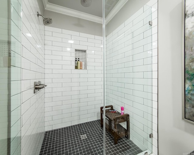 bathroom with tiled shower, tile patterned flooring, and ornamental molding