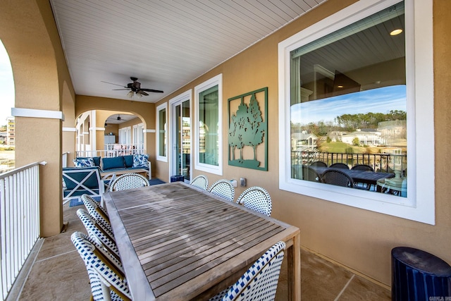 exterior space with ceiling fan