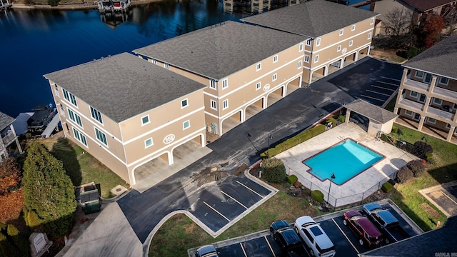 birds eye view of property with a water view