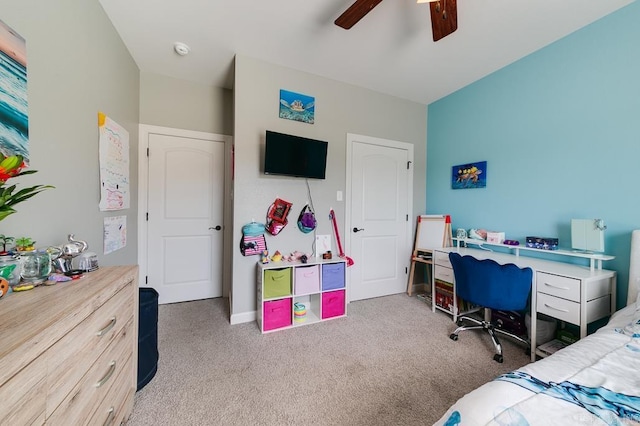 bedroom featuring light colored carpet and ceiling fan