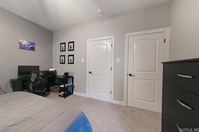 bedroom featuring light carpet