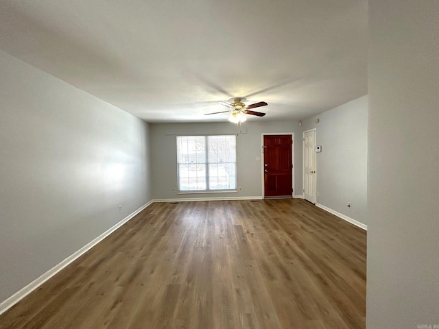 unfurnished room with hardwood / wood-style floors and ceiling fan