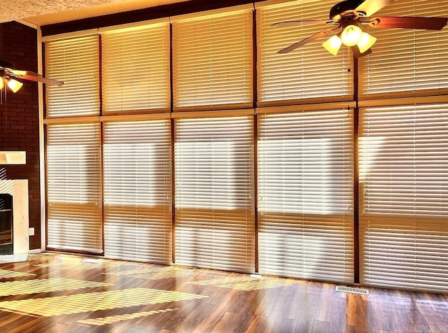 details with ceiling fan and wood-type flooring