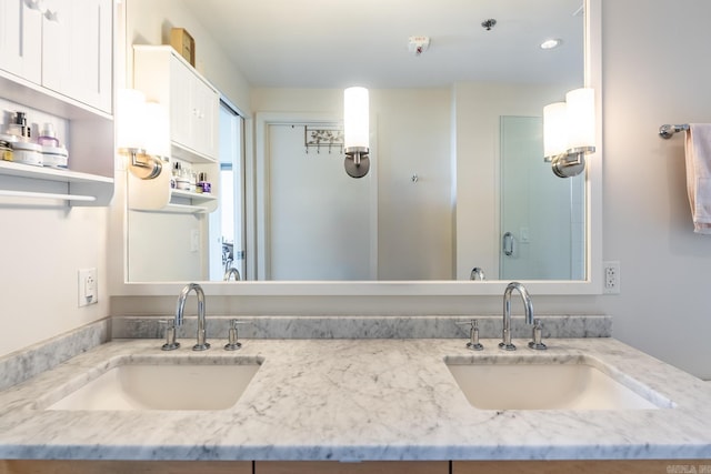 bathroom with vanity and walk in shower