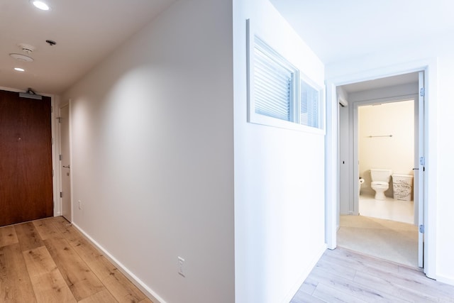 corridor featuring light hardwood / wood-style floors