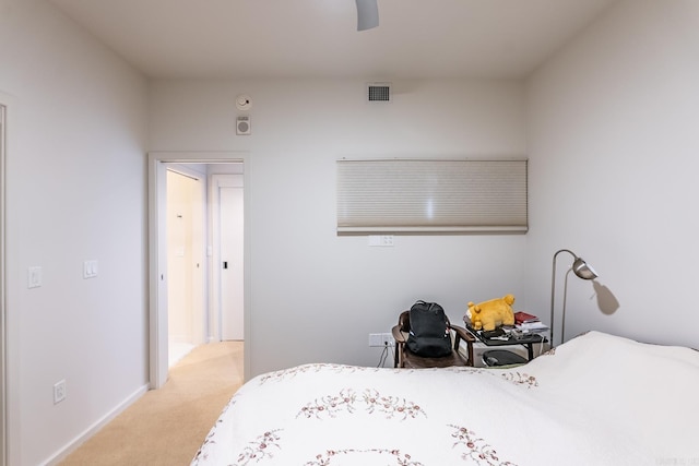 bedroom featuring ceiling fan and light carpet