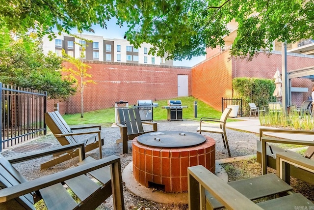 view of patio / terrace featuring a fire pit and a grill